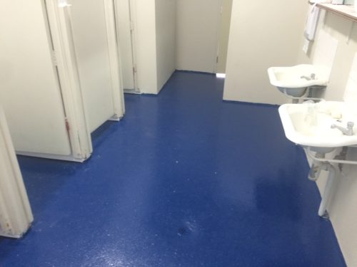 Public Toilet with Non-Slip Floor Coating System